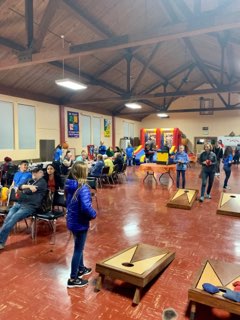 People playing Cornhole