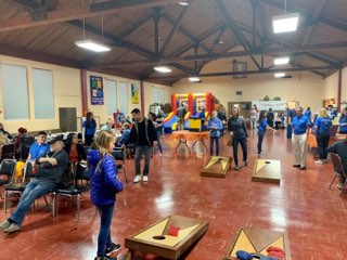 People playing Cornhole